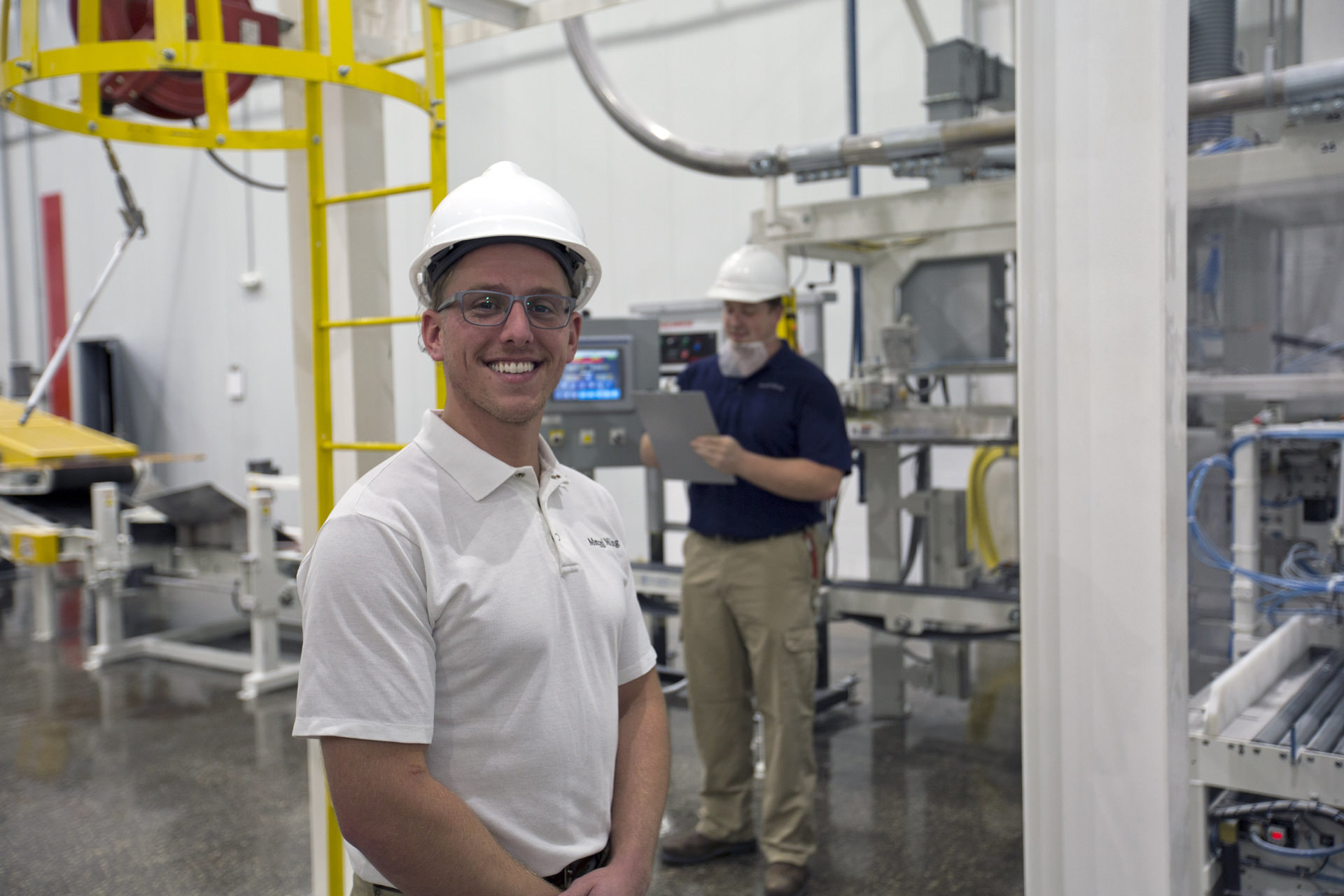 Employees working in the packaging and extrusion plant